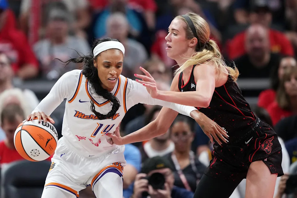 INDIANAPOLIS, INDIANA - JULY 30: DeWanna Bonner #14 of the Phoenix Mercury dribbles the ball while being guarded by Lexie Hull #10 of the Indiana Fever in the third quarter at Gainbridge Fieldhouse on July 30, 2025 in Indianapolis, Indiana. NOTE TO USER: User expressly acknowledges and agrees that, by downloading and or using this photograph, User is consenting to the terms and conditions of the Getty Images License Agreement. (Photo by Dylan Buell/Getty Images)