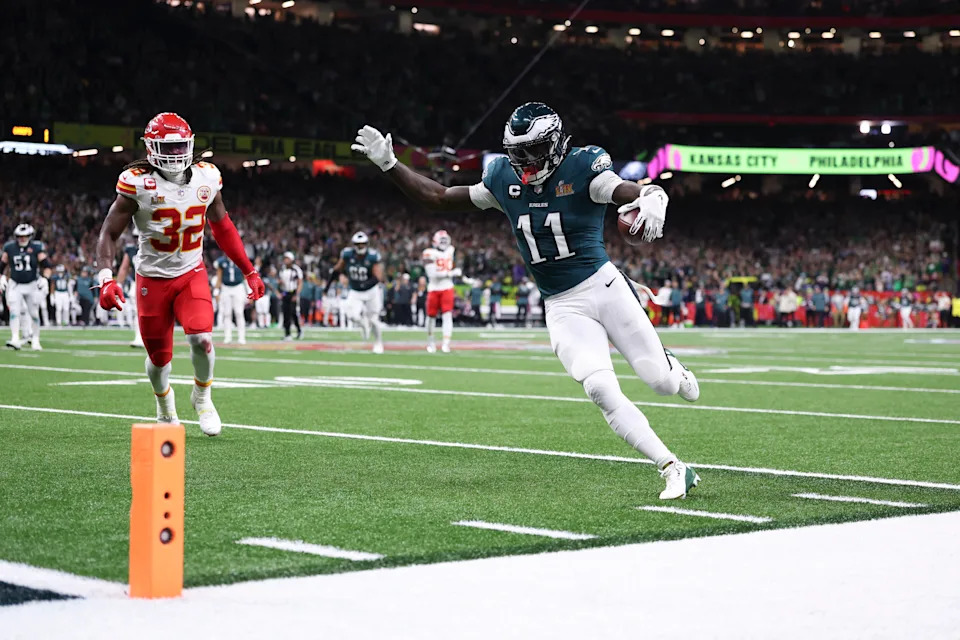 NEW ORLEANS, LOUISIANA - FEBRUARY 09: A.J. Brown (11) of the Philadelphia Eagles runs the ball for a touchdown during Super Bowl LIX against the Kansas City Chiefs at Caesars Superdome on February 09, 2025, in New Orleans, Louisiana. The Eagles defeated the Chiefs 40-22. (Photo by Logan Bowles/Getty Images)