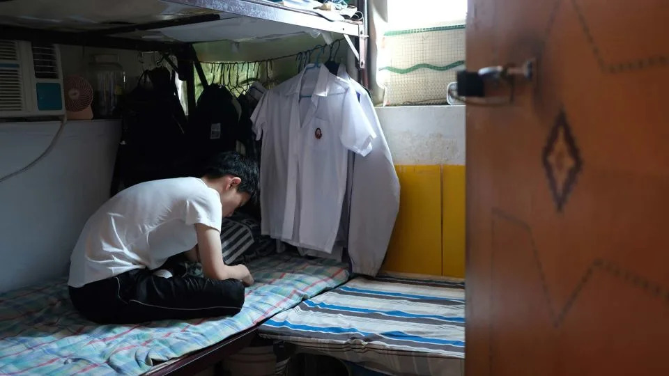 Ms. Yeung's grandson in their shared bedroom at their home in Sham Shui Po, Hong Kong, on July 4, 2025. - Catherine Phillips/CNN