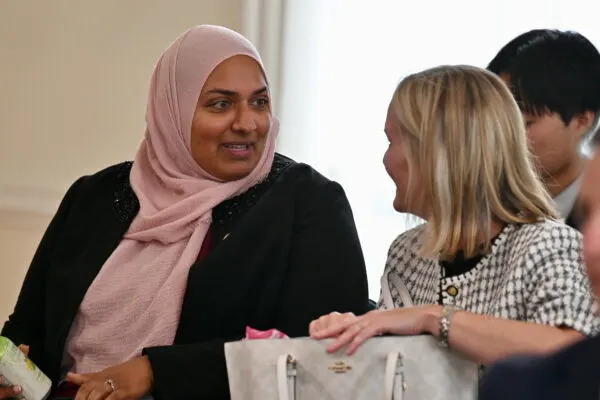 Chief Performance Officer Asma Mirza (left) speaks with state Budget Secretary Helene Grady during a July meeting of the Board of Public Works. (File photo by Bryan P. Sears/Maryland Matters)