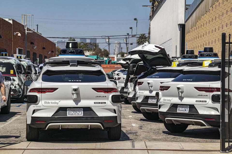 dozens of new driverless waymo cars on the streets and inside the garage on west los angeles.