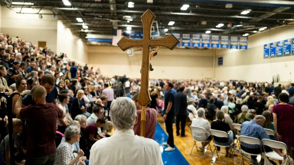 Members of Catholic clergy arrive at a vigil following a mass shooting at Annunciation Catholic School on Wednesday in Richfield, Minnesota. - Stephen Maturen/Getty Images