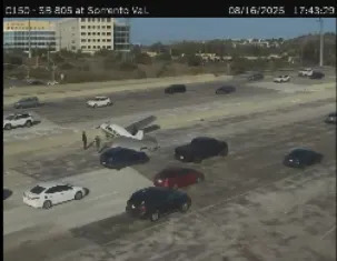 Small plane lands in middle of San Diego highway (PHOTO: Caltrans traffic camera) 