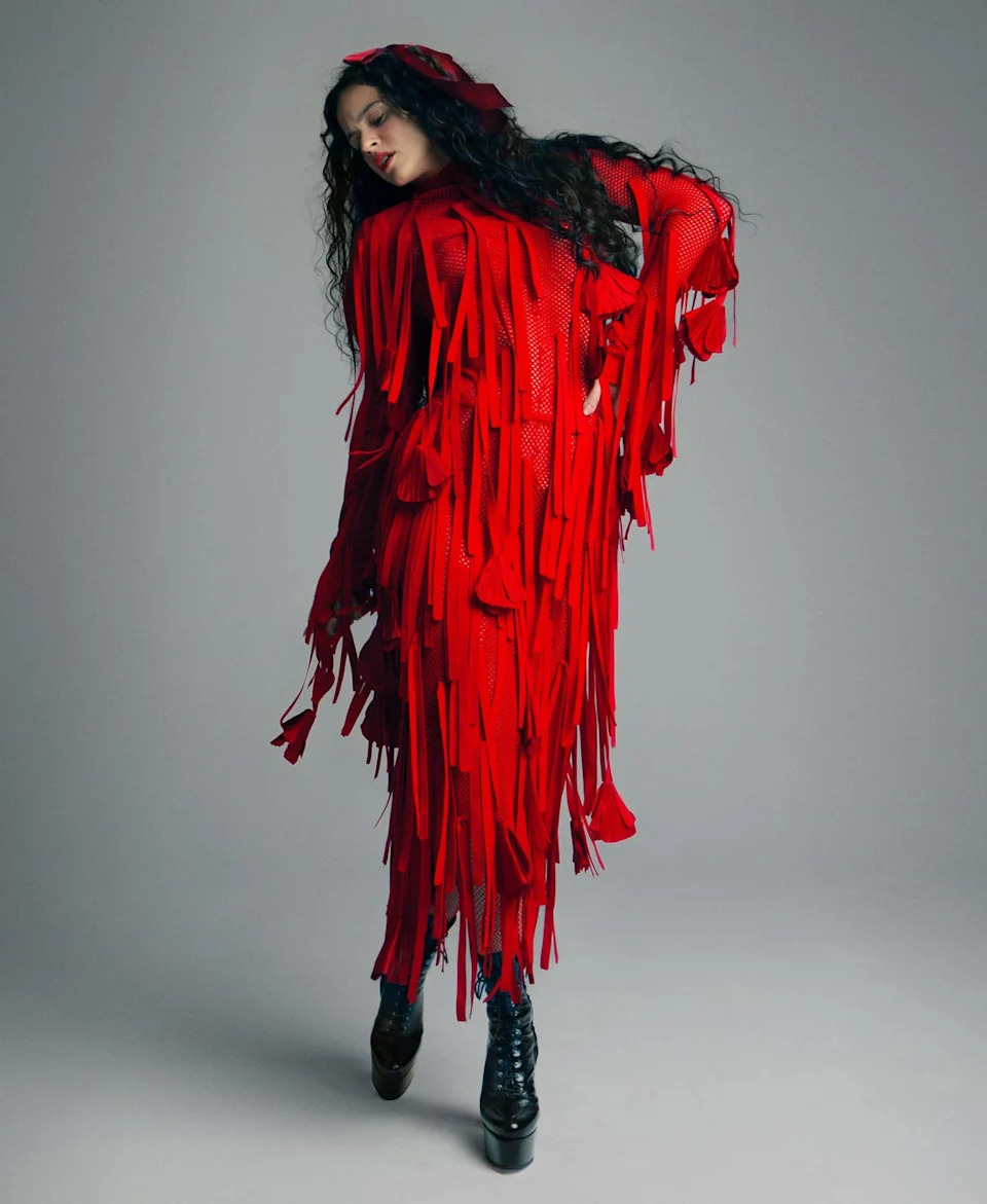 rosalia in a red ferragamo dress