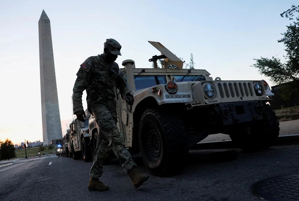 National Guard troops next to the Washington Monument