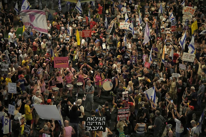 People take part in a protest demanding the end of the war, the immediate release of hostages held by Hamas in the Gaza Strip, and against Prime Minister Benjamin Netanyahu's government in Tel Aviv, Saturday, Aug. 16, 2025. / Credit: Mahmoud Illean / AP