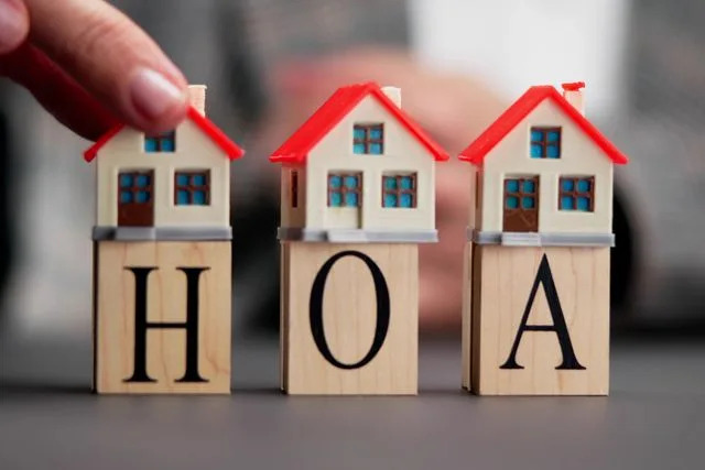 Getty Tiny houses sitting on top of blocks with the letters H, O and A (stock image).