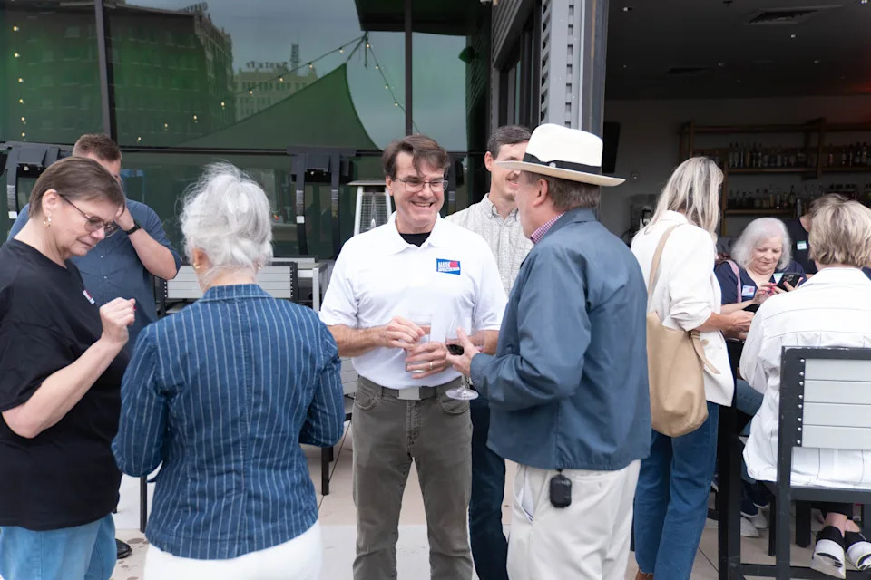 Mark Nair, center, greets supporters during his campaign launch event at Crush Wine Bar and Grill in downtown Amarillo on Aug. 26, 2025. Nair, a former Amarillo City Council member, announced his bid for Congress in Texas’ 13th District with a “People First” agenda.