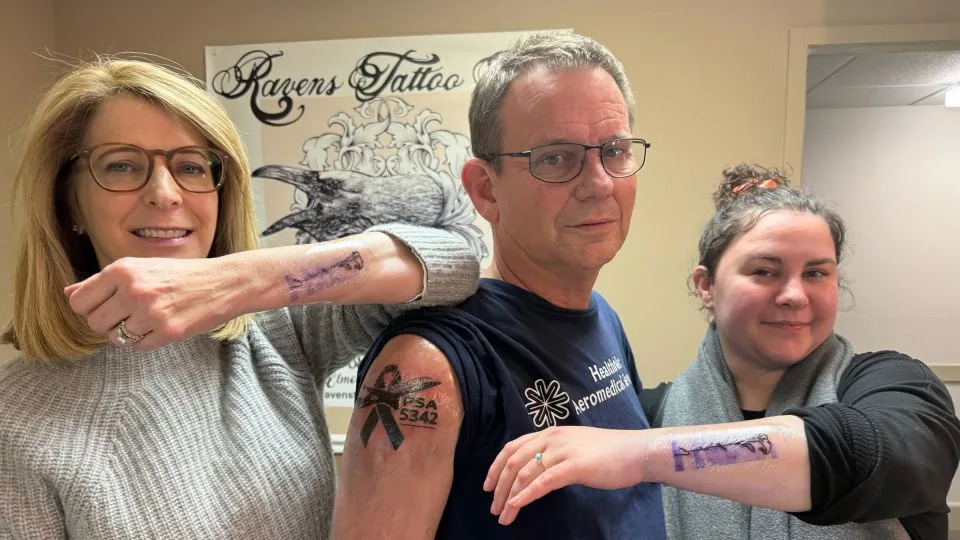 Sheri Lilley, Tim Lilley and Lydia Coles after they got tattoos in honor of Sam. - Courtesy Lilley Family