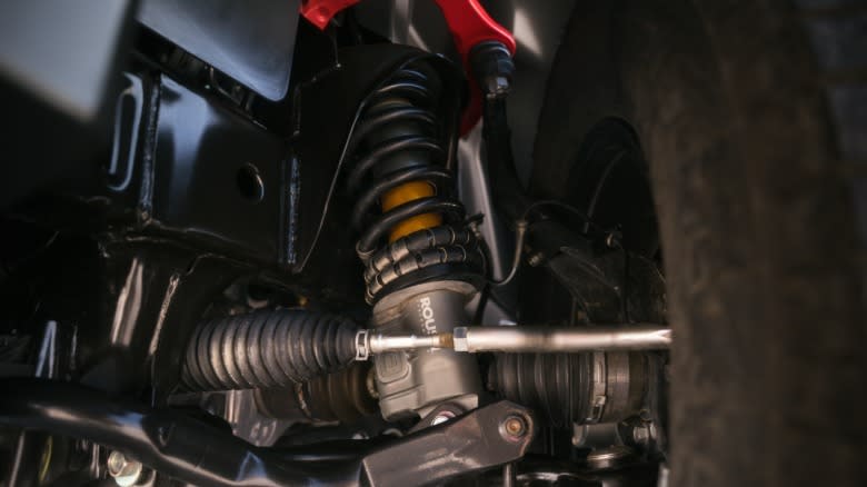 a close-up of the Frontier Pro-4X R's Ohlins dampers