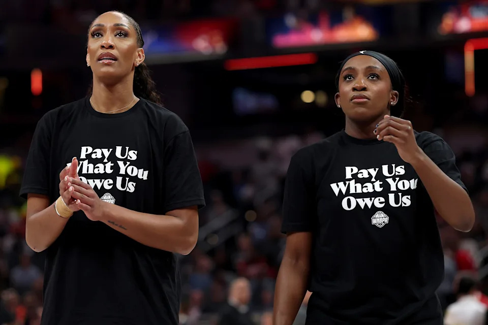 INDIANAPOLIS, INDIANA - JULY 19: A’ja Wilson #22 of the Las Vegas Aces and Jackie Young #0 of the Las Vegas Aces wear shirts saying