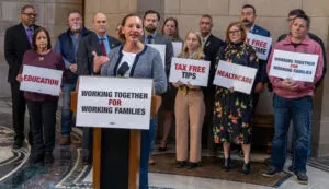  State Sen. Danielle Conrad of Lincoln, center, unveils a “working families agenda” with nine of her colleagues and other advocates at the Nebraska State Capitol. Jan. 23, 2025. (Zach Wendling/Nebraska Examiner)