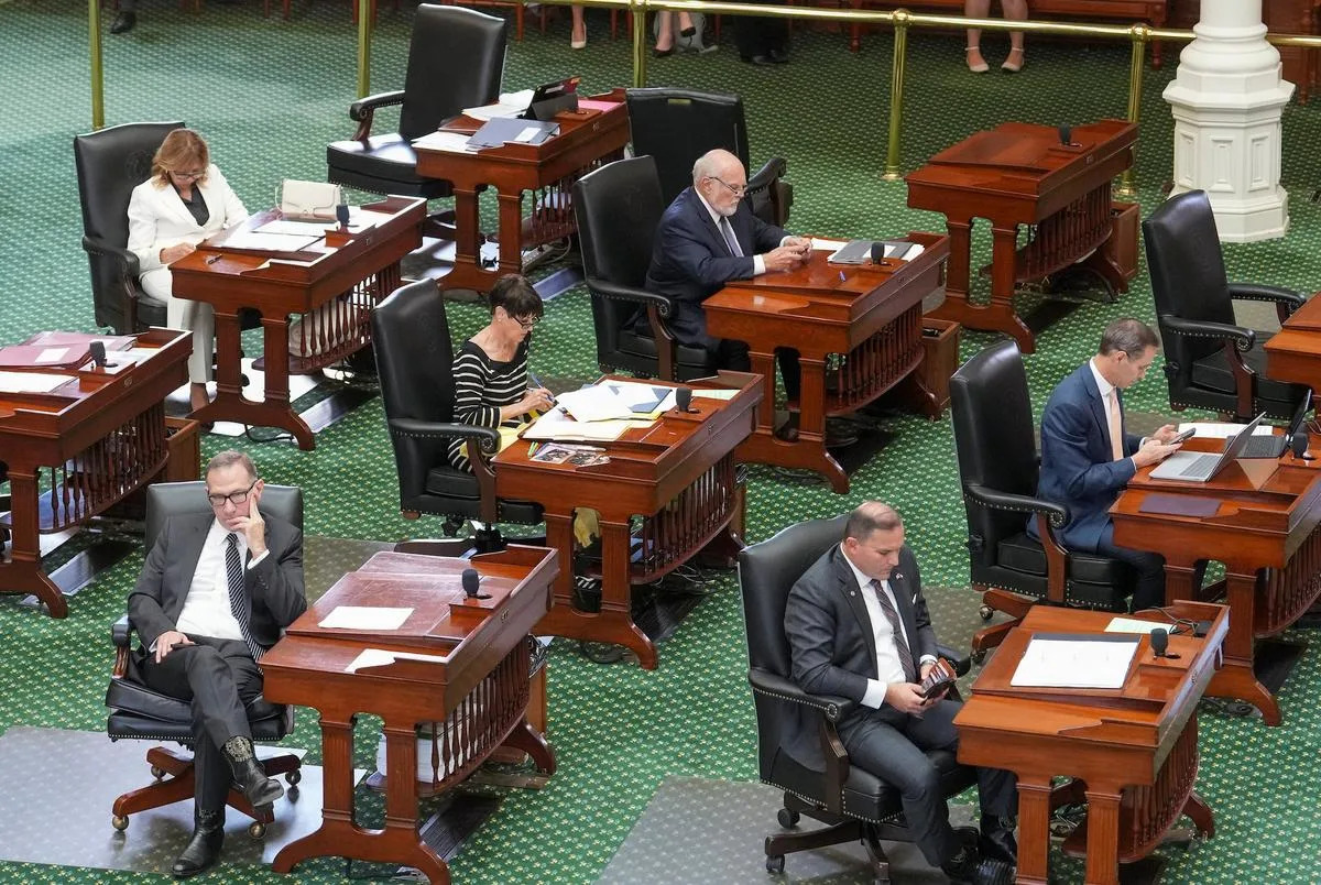 Texas state senators take care of business at their desks during floor debate on SB5 the THC regulation bill on Wednesday, July 30, 2025.  Clockwise from upper left are Sen. Joan Huffman, R-Houston, Sen. Robert Nichols, R-Jacksonville, Sen. Nathan Johnson, D-Dallas, Sen. Adam Hinojosa, D-Corpus Christi, Sen Charles Schwertner, R-Georgetown and Sen. Donna Campbell, R-New Braunfels.