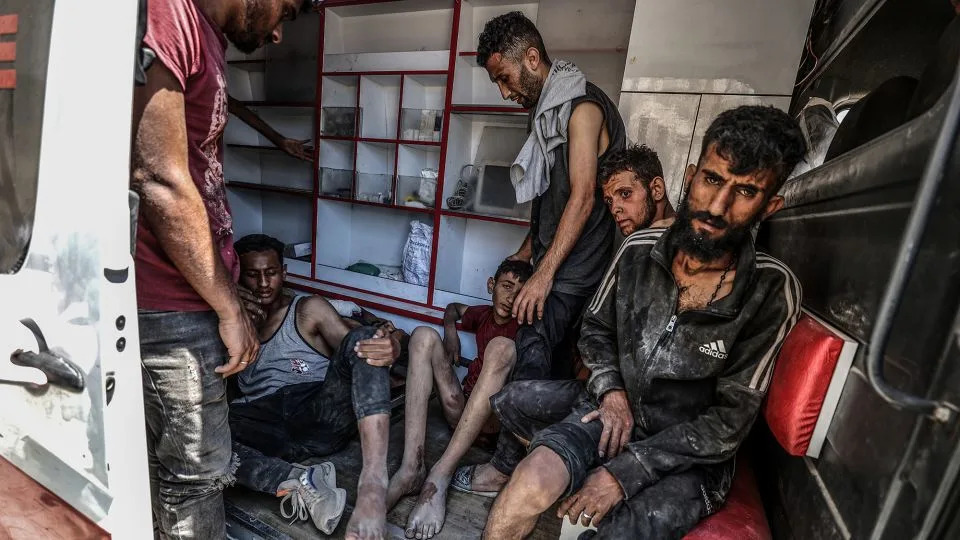 Injured Palestinians are transported to hospitals after Israeli forces open fire on civilians waiting for humanitarian aid in the Zikim area on Sunday. - Ali Jadallah/Anadolu/Getty Images