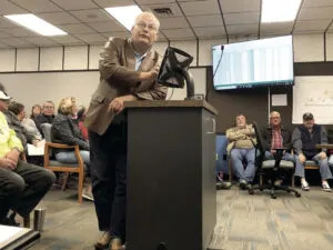 Bob Skarphol shows a group of mineral royalty owners the breakdown of a royalty statement. At that October 2018 meeting, Skarphol and other mineral owners founded the Williston Basin Royalty Owners Association. (Jamie Kelly/Williston Herald)