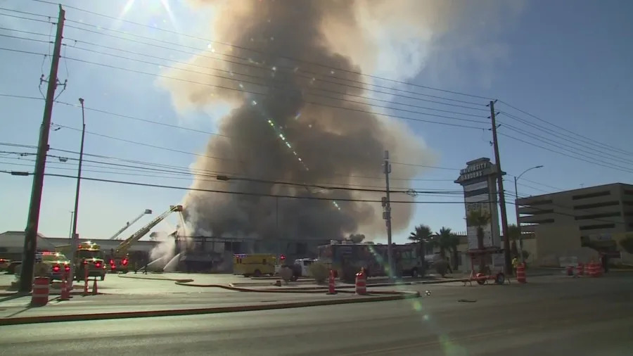 Clark County fire crews battle a large blaze at a business complex across the street from the UNLV campus on Maryland Parkway, near Tropicana Avenue on July 25, 2025. (KLAS)