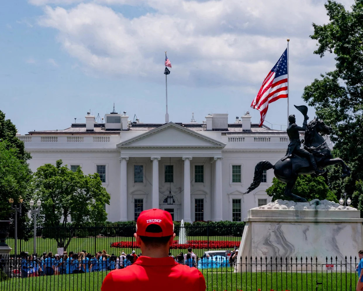 <span>A Trump supporter outside the White House in June.</span><span>Photograph: Nathan Howard/Reuters</span>