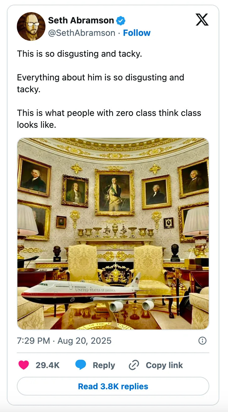 A room with opulent decor and numerous portraits. A small aircraft model is on the table. Tweet describes the scene as "disgusting and tacky."