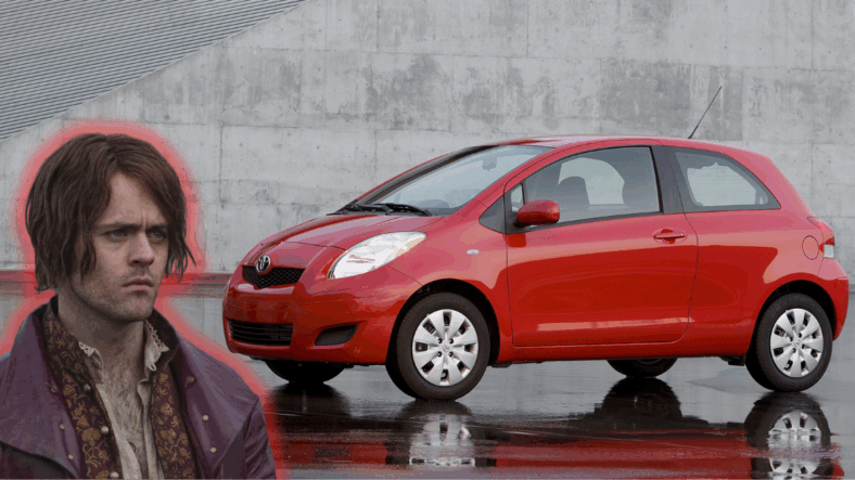 Dandelion standing next to a Toyota Yaris