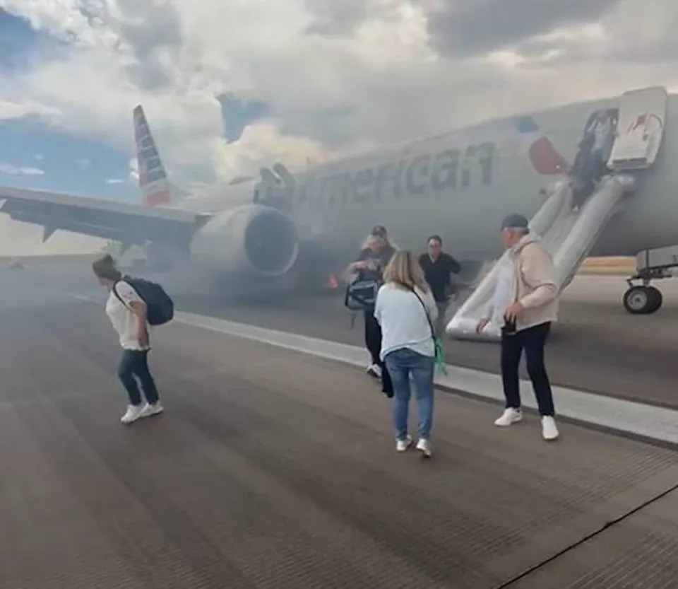 Courtesy @highlymigratoryfishing/instagram - PHOTO: Passengers of an American Airlines flight exited the plan via emergency slide after an aborted takeoff in Denver on Saturday.