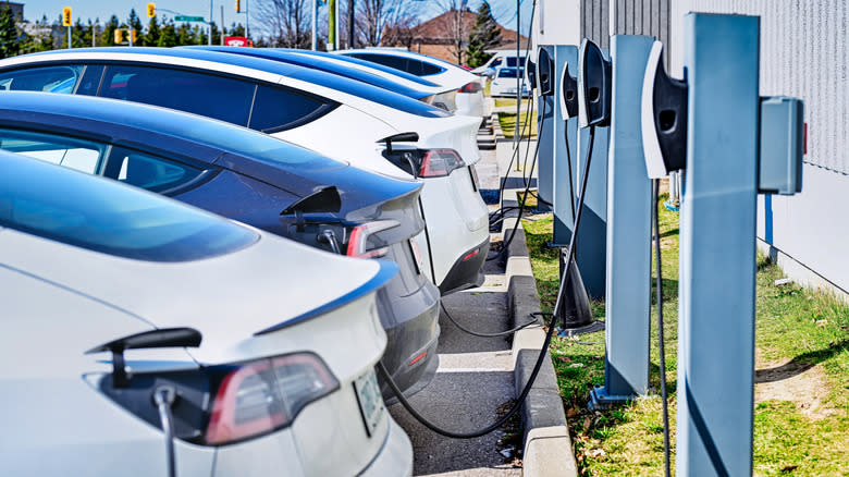 Toronto, Ontario, Canada - March 13, 2024: Tesla electric cars charging at supercharger station.