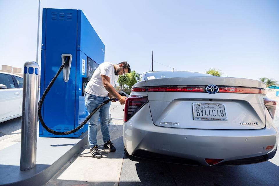 alan alcala, of whittier, fills up his 2019 toyota mirai fuel cell vehicle with h70 at a truezero hydrogen fuel station...