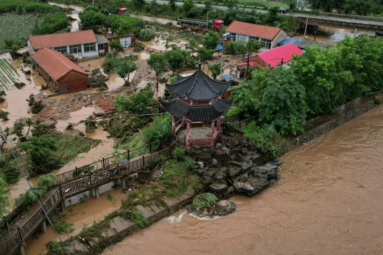 In Beijing, over 3,000 people in suburban Miyun district were evacuated due to torrential rains (Jade GAO)