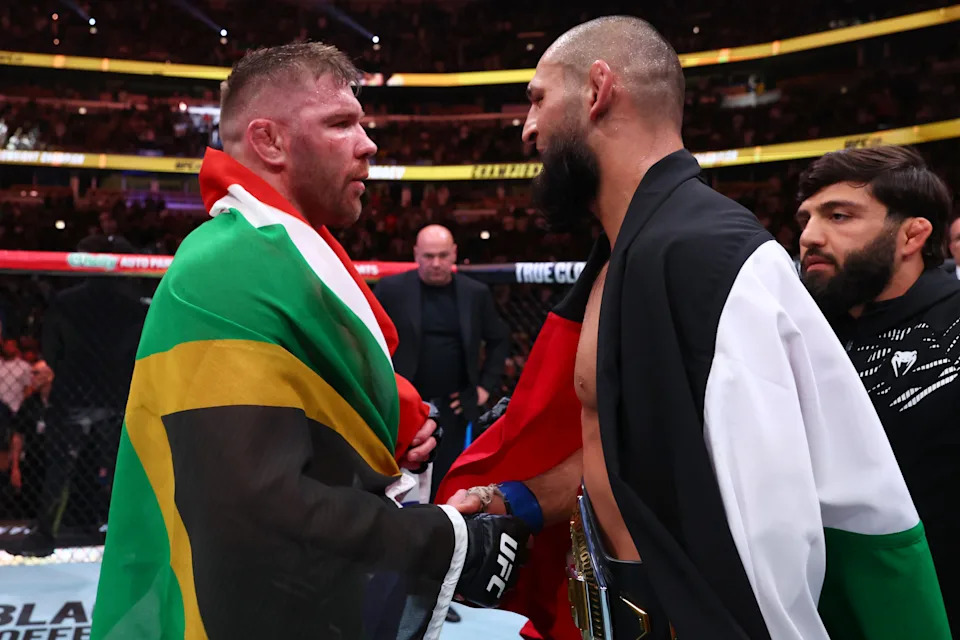 CHICAGO, ILLINOIS - AUGUST 16: (R-L) Khamzat Chimaev of Russia and Dricus Du Plessis of South Africa talk after the UFC middleweight championship fight during the UFC 319 event at the United Center on August 16, 2025 in Chicago, Illinois. (Photo by Ed Mulholland/Zuffa LLC)