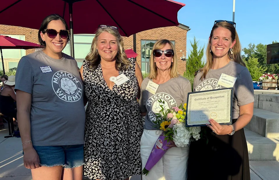 (From left to right) Katherine Pfander, Windy Steiner, Elaine Damo and Colleen Kelley, of Mission Warmth, accept the Gahanna GLOW Summer Give Impact Award on July 23. The nonprofit organization that serves the homeless was awarded $14,500.