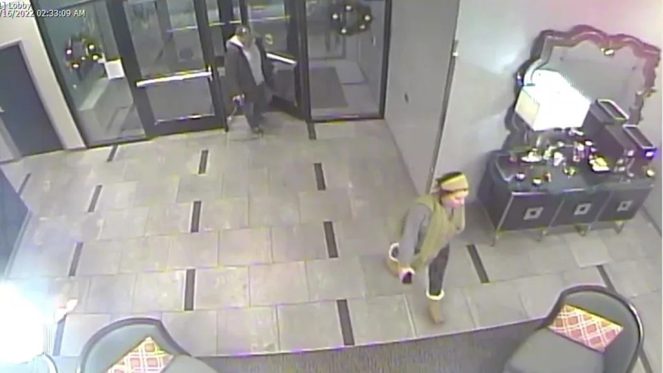 Alex Pennig, foreground, and Matthew Ecker walk through the lobby together for the last time. / Credit: Ramsey County District Court