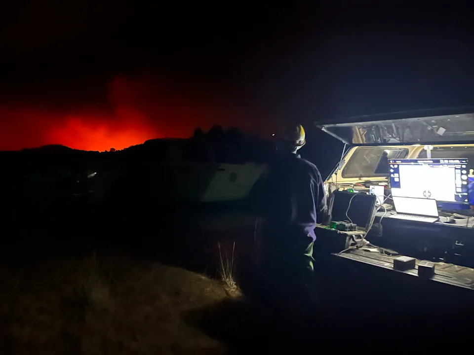 Fire personnel use drones for aerial support during a backburn operation in 2024.