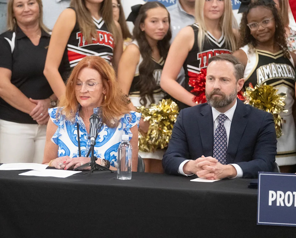 Amarillo ISD Superintendent Dr. Deidre Parish speaks during Gov. Greg Abbott’s bill signing ceremony Aug. 1, 2025, at AmTech Career Academy in Amarillo. Seated next to her is Texas House Speaker Dustin Burrows.