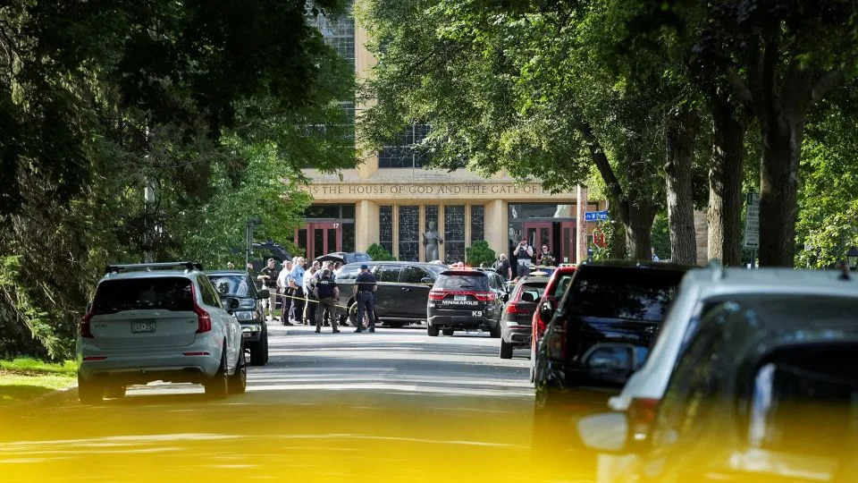 Law enforcement officers gather outside the church Wednesday. - Tim Evans/Reuters