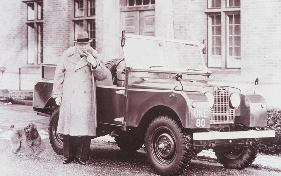 Winston Churchill smoking a cigar next to his Series I