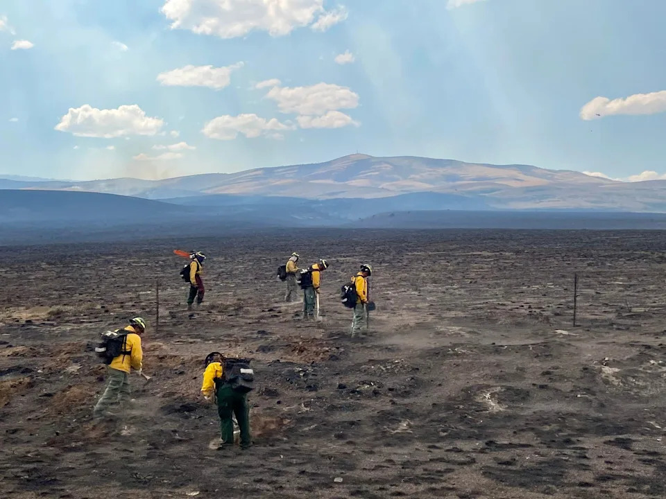 Fire crews work to battle hotspots from the Monroe Canyon Fire in Utah.