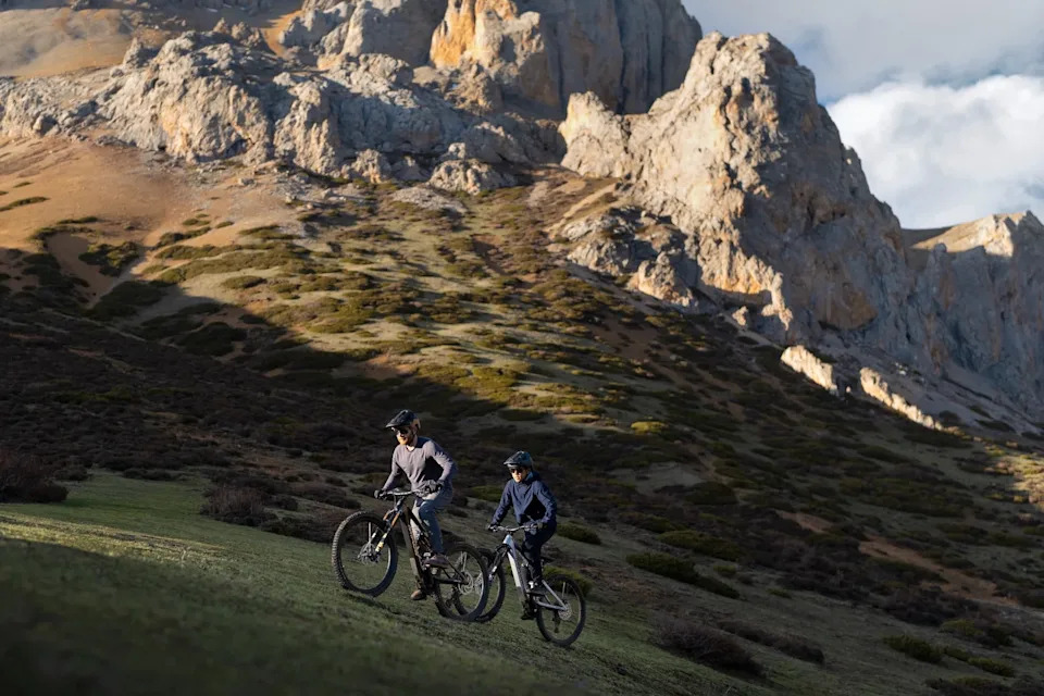 Two riders climbing a hill on the Amflow PL carbon bikes.