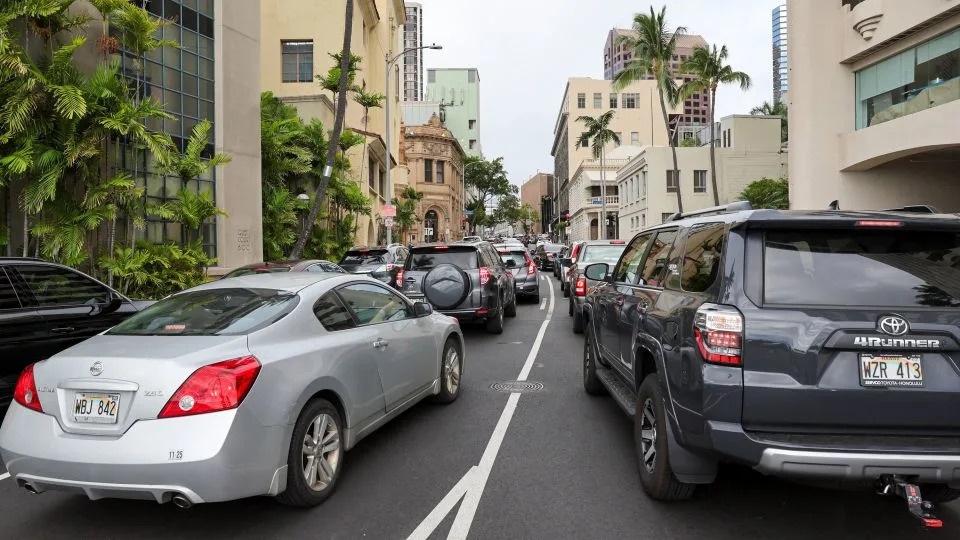 Traffic builds on Bethel Street heading north in downtown Honolulu after authorities warned residents of the possibility of a destructive tsunami. - Marco Garcia/Reuters