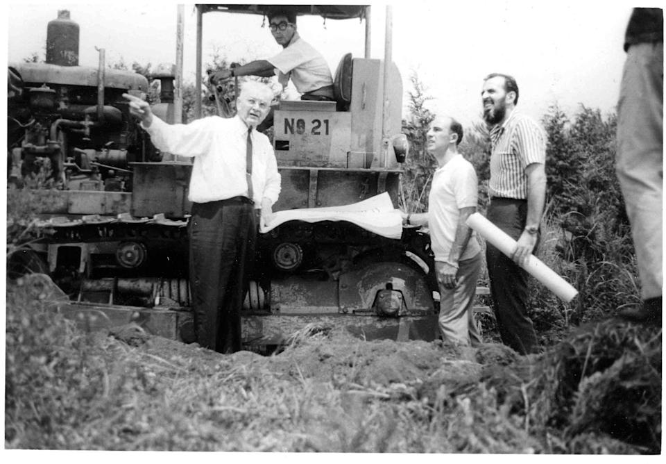 charlie moneypenny during planning phase of fuji speedway, japan, with don nichols, stirling moss and others.