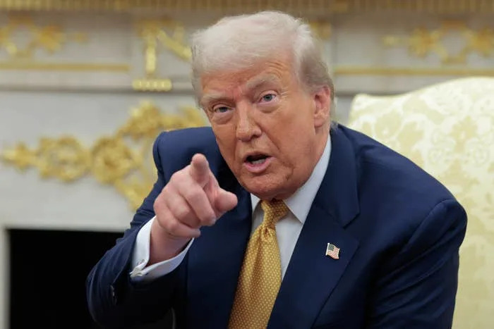 U.S. President Donald Trump calls on a reporter during a meeting