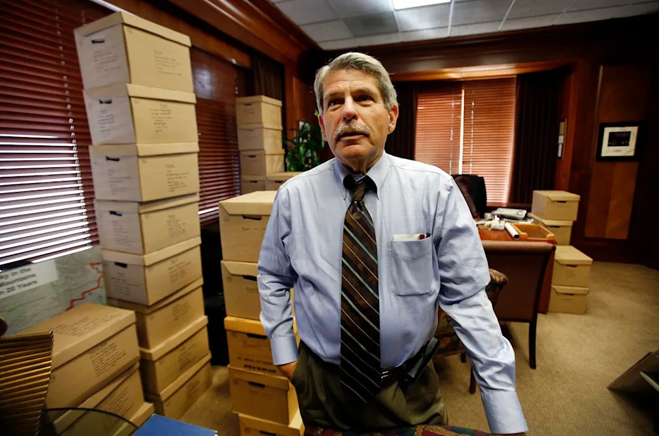 A man stands in an office.