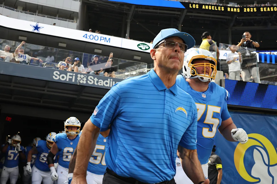 INGLEWOOD, CA - AUGUST 16: Los Angeles Chargers head coach Jim Harbaugh runs out of the tunnel with the team at the beginning of a NFL preseason game between the Los Angeles Rams and the Los Angeles Chargers on August 16, 2025, at SoFi Stadium in Inglewood, CA. (Photo by Greg Fiore/Icon Sportswire via Getty Images)