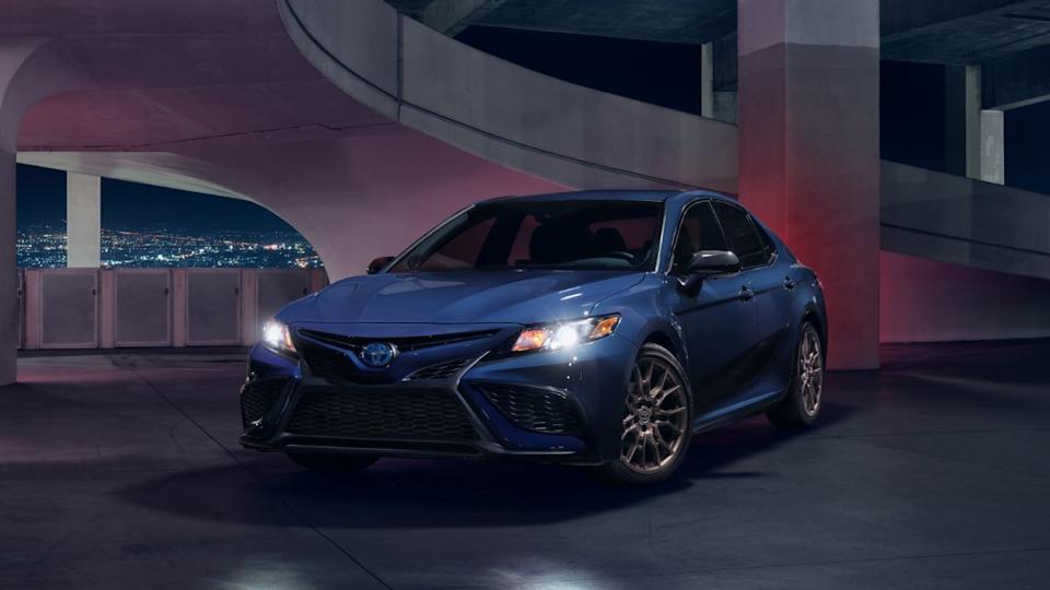 A blue 2024 Toyota Camry Hybrid