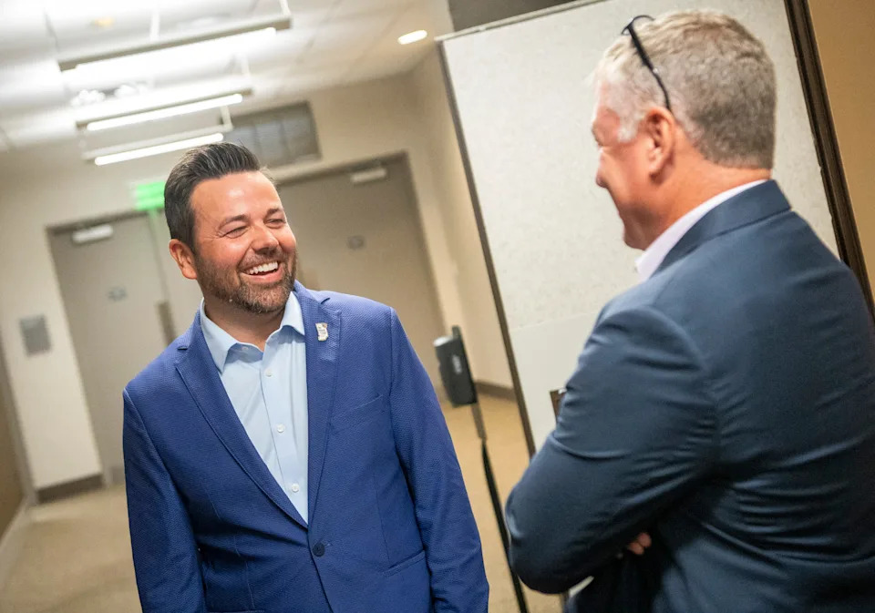 Lt. Gov. Micah Beckwith speaks with Rick Wajda, chief executive officer of the Indiana Builders Association at their event at the Monroe Convention Center on Thursday, Aug. 21, 2025.