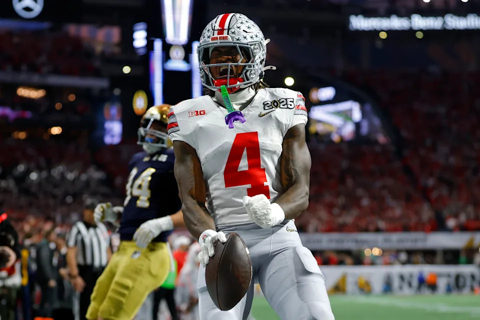 ATLANTA, GEORGIA - JANUARY 20: Jeremiah Smith #4 of the Ohio State Buckeyes reacts after scoring a touchdown during the second quarter against the Notre Dame Fighting Irish in the 2025 CFP National Championship at Mercedes-Benz Stadium on January 20, 2025 in Atlanta, Georgia. (Photo by Todd Kirkland/Getty Images)