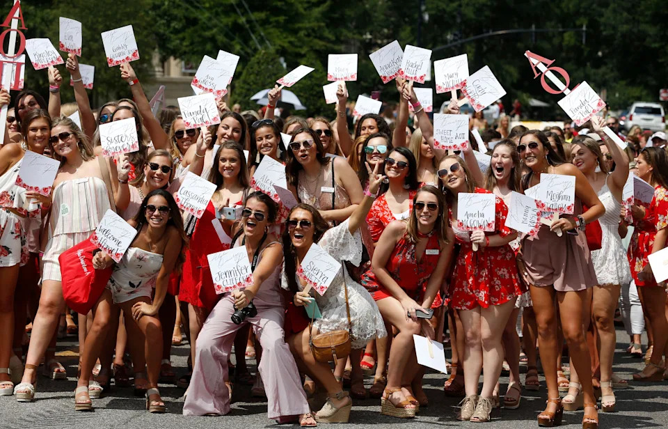 New sorority sisters join their sororities on Bid Day Sunday, August 19, 2018 on Sorority Row outside Bryant-Denny Stadium. Members of the Alpha Omicron Pi sorority wait to welcome their new members. [Staff Photo/Gary Cosby Jr.]