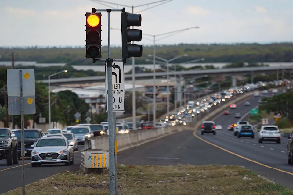Oahu residents evacuate Ewa Beach due to the threat of a tsunami in Kapolei, Oahu, Hawaii, on Tuesday, 29 July (AP)