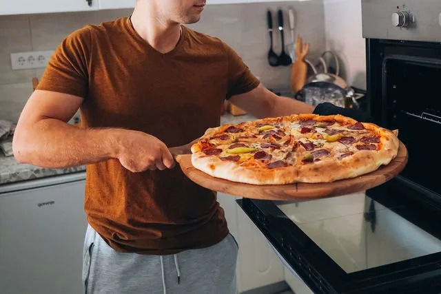 Getty Stock photo of a man making a pizza