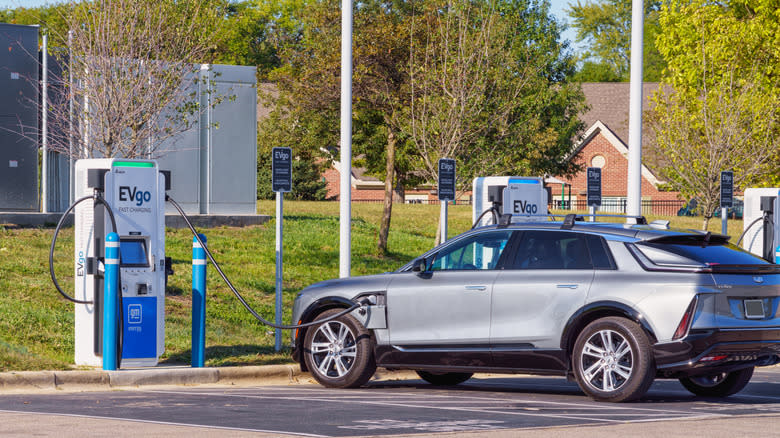 Cadillac LYRIQ electric car at EVgo fast charging station.