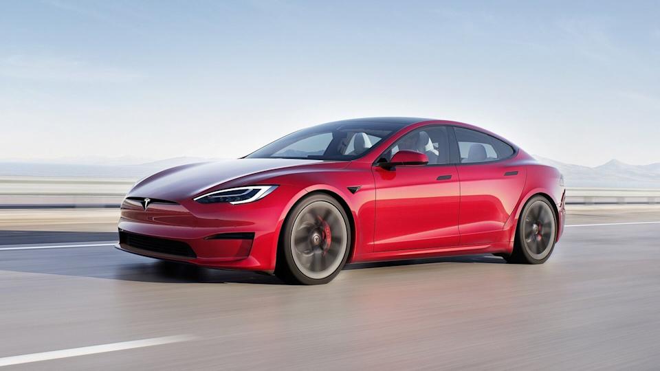 Red 2021 Tesla Model S Plaid Driving On The Road Front 3/4 View
