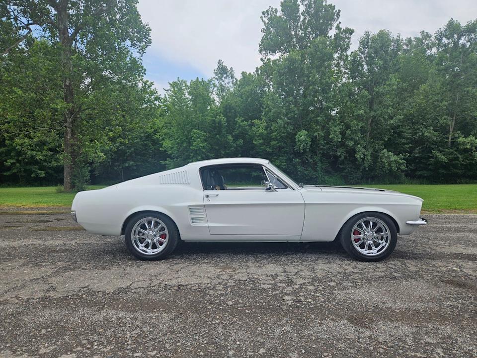 1967 ecd mustang restomod ghost profile view in parking lot
